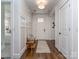 Inviting foyer with hardwood floors, a decorative rug, bench seating and board and batten accents at 815 Digby Rd, Rock Hill, SC 29730