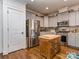 Stylish kitchen featuring gray cabinetry, stainless steel appliances, and hardwood flooring at 815 Digby Rd, Rock Hill, SC 29730