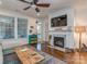 The living room features a marble fireplace, lots of light, hardwood floors and comfortable seating at 815 Digby Rd, Rock Hill, SC 29730