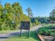 Enjoy the outdoors on this scenic walking trail with a wooden fence and lush greenery under a clear sky at 815 Digby Rd, Rock Hill, SC 29730