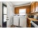 Convenient laundry area located off the kitchen, equipped with modern appliances and storage at 970 Willowbrook Ave, Rock Hill, SC 29730