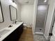 Contemporary bathroom with double vanity, sleek black accents, and a luxurious walk-in shower at 1022 Johnna Ln, Indian Land, SC 29707