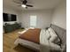 Spacious bedroom with hardwood floors, ceiling fan, and a television above a dresser at 1022 Johnna Ln, Indian Land, SC 29707