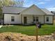 Charming home with a well-manicured lawn and inviting front porch with rocking chairs at 1022 Johnna Ln, Indian Land, SC 29707