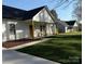 Beautiful home showcasing a lush green lawn and a cozy front porch, perfect for relaxing at 1022 Johnna Ln, Indian Land, SC 29707
