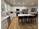 Modern kitchen featuring stainless steel appliances, white cabinetry and a large center island at 1022 Johnna Ln, Indian Land, SC 29707