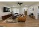 Spacious living room featuring stylish furniture, a cozy rug, and a large entertainment center at 1022 Johnna Ln, Indian Land, SC 29707
