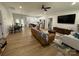 Open-concept living space with modern furnishings, hardwood floors, and ample natural light at 1022 Johnna Ln, Indian Land, SC 29707
