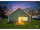 The backyard features a well-manicured lawn and charming exterior view at 1026 Dooley Dr, Charlotte, NC 28227