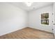 Bright bedroom featuring wood-look floors, a window, and a neutral color palette at 1026 Dooley Dr, Charlotte, NC 28227