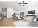 Open concept living space with island kitchen, sleek appliances, and stylish furniture creates a welcoming and modern atmosphere at 1026 Dooley Dr, Charlotte, NC 28227