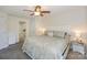 Bedroom with a ceiling fan, exterior view, and side view of bathroom at 104 Pier 33 Dr # 308, Mooresville, NC 28117