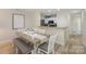 Dining area next to the kitchen, featuring a table and chairs for a comfortable and casual dining experience at 104 Pier 33 Dr # 308, Mooresville, NC 28117