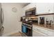Close-up of the kitchen area featuring stainless steel appliances and granite countertops at 104 Pier 33 Dr # 308, Mooresville, NC 28117