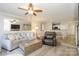 Open-concept living area featuring a dining area, a fireplace, and neutral decor at 104 Pier 33 Dr # 308, Mooresville, NC 28117