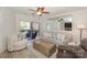 Comfortable living room with neutral tones, decorative pillows, and sliding glass doors to the outdoor balcony at 104 Pier 33 Dr # 308, Mooresville, NC 28117