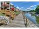 Wooden boardwalk along the waterfront, perfect for a leisurely stroll by the docks and boats at 104 Pier 33 Dr # 308, Mooresville, NC 28117