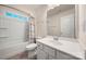 Bathroom featuring tub, shower and single sink at 10914 Zac Hill Rd, Davidson, NC 28036