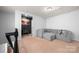 Upstairs bonus room with comfortable seating and decorative art at 10914 Zac Hill Rd, Davidson, NC 28036