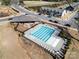 Aerial view of the community pool with multiple lounge chairs and tables, ready for relaxation and summer fun at 10914 Zac Hill Rd, Davidson, NC 28036