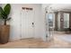 Bright foyer with light hardwood floors, a white front door, and open doorway at 10914 Zac Hill Rd, Davidson, NC 28036