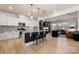 Well-lit open concept kitchen features a center island and views into the living room at 10914 Zac Hill Rd, Davidson, NC 28036