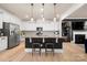 Open kitchen featuring a center island with seating, granite countertops, and stainless steel appliances at 10914 Zac Hill Rd, Davidson, NC 28036