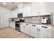 Bright kitchen includes stainless steel refrigerator and ample counter space at 10914 Zac Hill Rd, Davidson, NC 28036