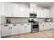 Modern kitchen featuring stainless steel appliances, granite countertops, and ample cabinet space at 10914 Zac Hill Rd, Davidson, NC 28036