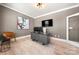 Bright office with a modern desk, mounted television, and stylish artwork at 10914 Zac Hill Rd, Davidson, NC 28036