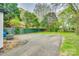Spacious backyard featuring trees, parking pad, and lawn at 110 Steele St # 34 35, Fort Mill, SC 29715
