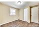 An interior shot of bedroom with laminate floors, closet and window at 110 Steele St # 34 35, Fort Mill, SC 29715