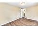 A bedroom featuring laminate wood flooring, neutral walls and a doorway at 110 Steele St # 34 35, Fort Mill, SC 29715