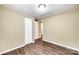 A bedroom featuring closet and doorway and laminate wood flooring at 110 Steele St # 34 35, Fort Mill, SC 29715