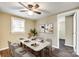 Well-lit dining room featuring hardwood floors, a modern table, and a ceiling fan at 110 Steele St # 34 35, Fort Mill, SC 29715