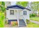 Charming cottage-style home with white siding, black trim, and inviting front porch at 110 Steele St # 34 35, Fort Mill, SC 29715