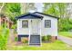 Charming cottage-style home with white siding, black trim, and inviting front porch at 110 Steele St # 34 35, Fort Mill, SC 29715