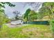 View of a detached garage with siding and green lawn in the backyard at 110 Steele St # 34 35, Fort Mill, SC 29715
