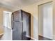 A kitchen with laminate wood flooring, black refrigerator, and beige walls at 110 Steele St # 34 35, Fort Mill, SC 29715