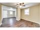 Open living room with hardwood floors, neutral walls, and a ceiling fan at 110 Steele St # 34 35, Fort Mill, SC 29715