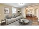 Cozy living room with neutral walls, plush sofa, and open view to the dining area at 110 Steele St # 34 35, Fort Mill, SC 29715