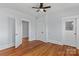 Cozy bedroom with hardwood floors, ceiling fan, and neutral walls at 126 E Henderson St, Salisbury, NC 28144
