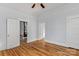 Bright bedroom showcasing hardwood floors, white trim, and entryways to other rooms in the home at 126 E Henderson St, Salisbury, NC 28144