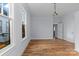 Bright bedroom showcasing hardwood floors, neutral walls, and an entry to another room in the home at 126 E Henderson St, Salisbury, NC 28144