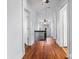 Bright hallway features hardwood floors, neutral walls, and classic trim at 126 E Henderson St, Salisbury, NC 28144