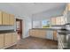Well-lit kitchen with a sink under large windows and plenty of cabinet storage at 126 E Henderson St, Salisbury, NC 28144