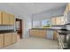 Bright kitchen with a sink under large windows and plenty of cabinet storage at 126 E Henderson St, Salisbury, NC 28144