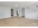 Spacious, light-filled living room with hardwood flooring and multiple entryways at 126 E Henderson St, Salisbury, NC 28144