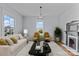 Cozy living room featuring hardwood floors, a decorative fireplace, and comfortable seating for relaxing at 126 E Henderson St, Salisbury, NC 28144