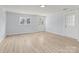 Inviting living room with hardwood floors and a bright entrance door and windows at 126 E Henderson St, Salisbury, NC 28144
